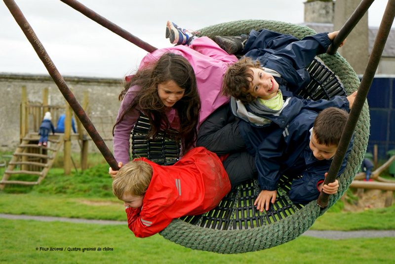 playground-swing-four-children