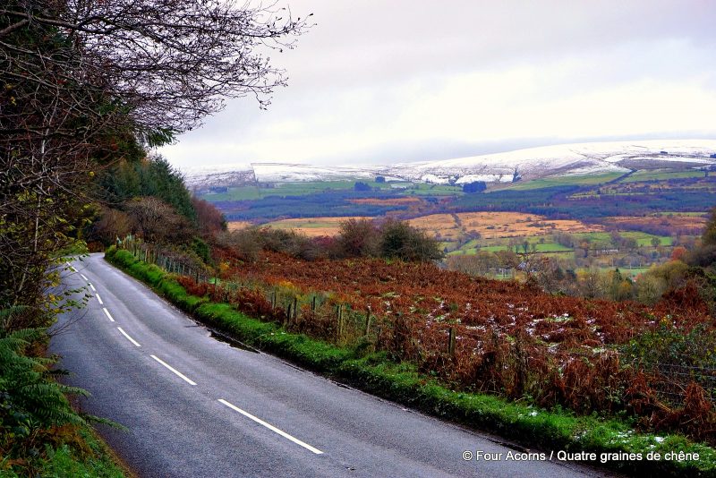 winter-landscape-road-autumn-colours-snow-on-hills