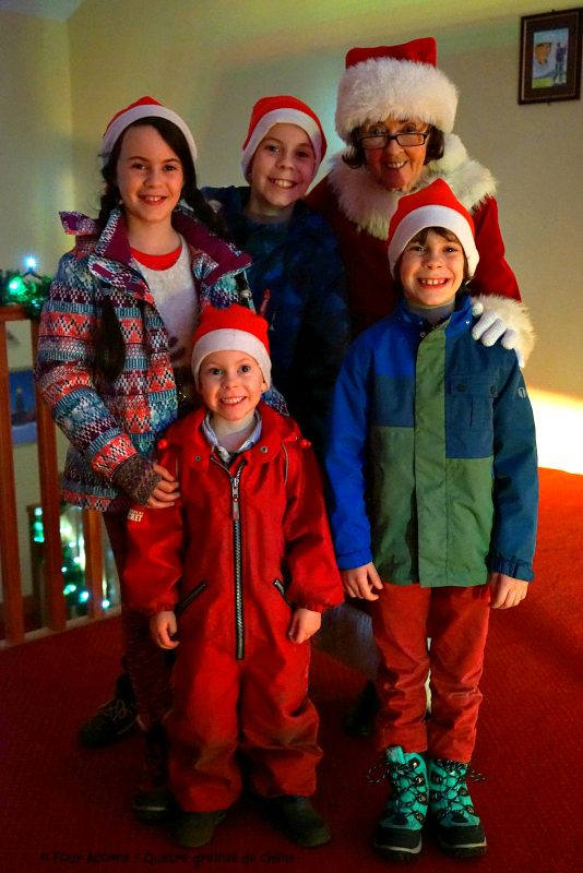 mrs-claud-four-children-santa-hats