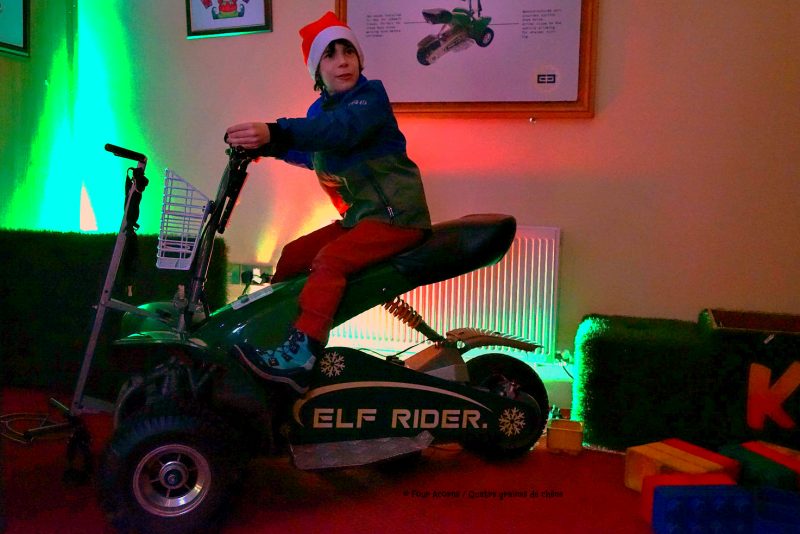 boy-santa-hat-rides-elf-rider