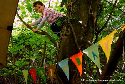 child-climbing-tree-birthday-banner