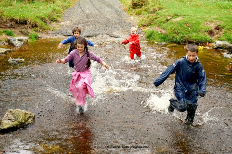 four-children-running-across-river