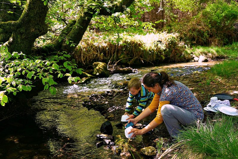 mother-son-washing-up-stream-river