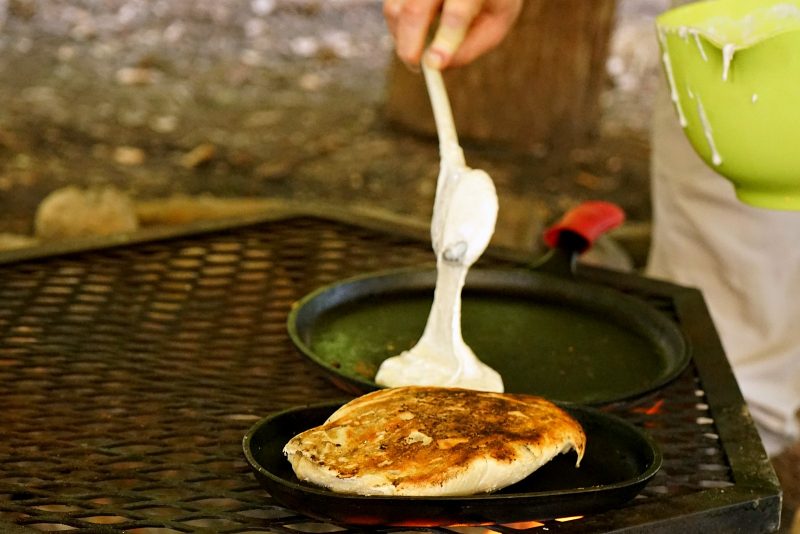 pancake-batter-cooking-campfire-cast-iron-cookware