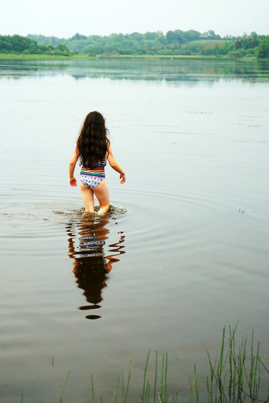 lough-oughter-girl-water-reflection