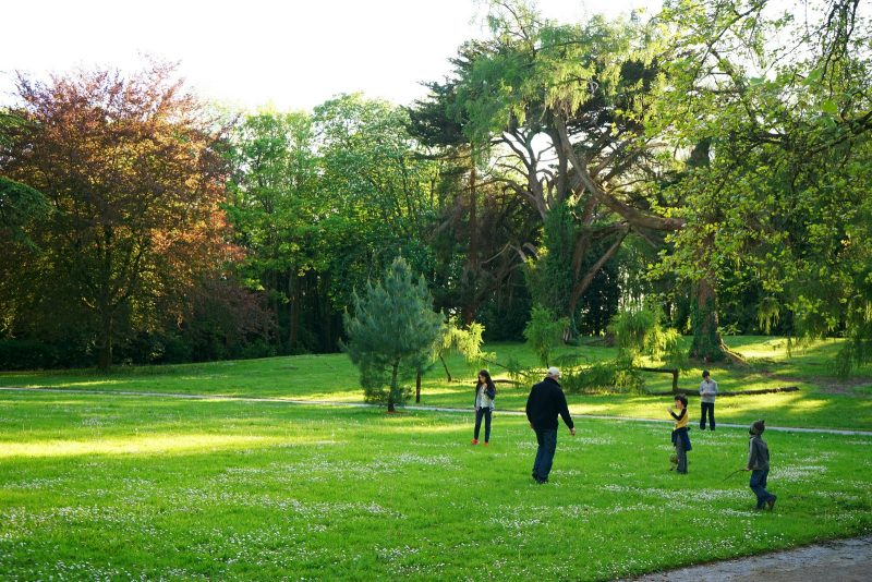 family-playing-arboretum-sunlight